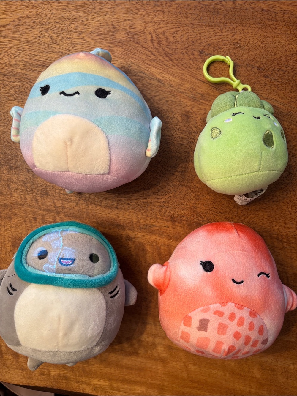 Squishmallows pastel rainbow, green, gray, and coral plush bundle